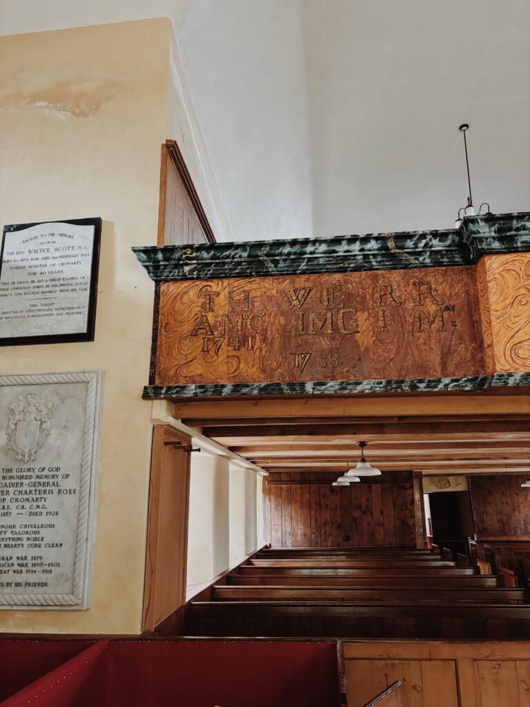 Interior of East Church, with a decorated wooden balcony facing